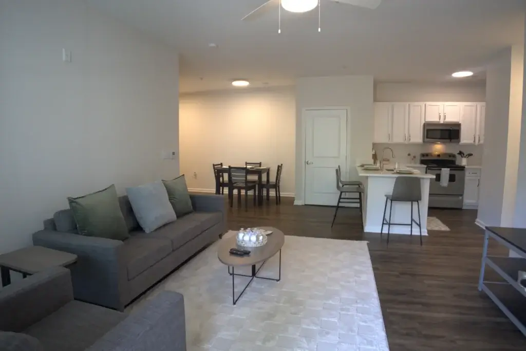 Enjoy Open-Concept Living with Stylish Furnishings and a Fully Equipped Kitchen Image