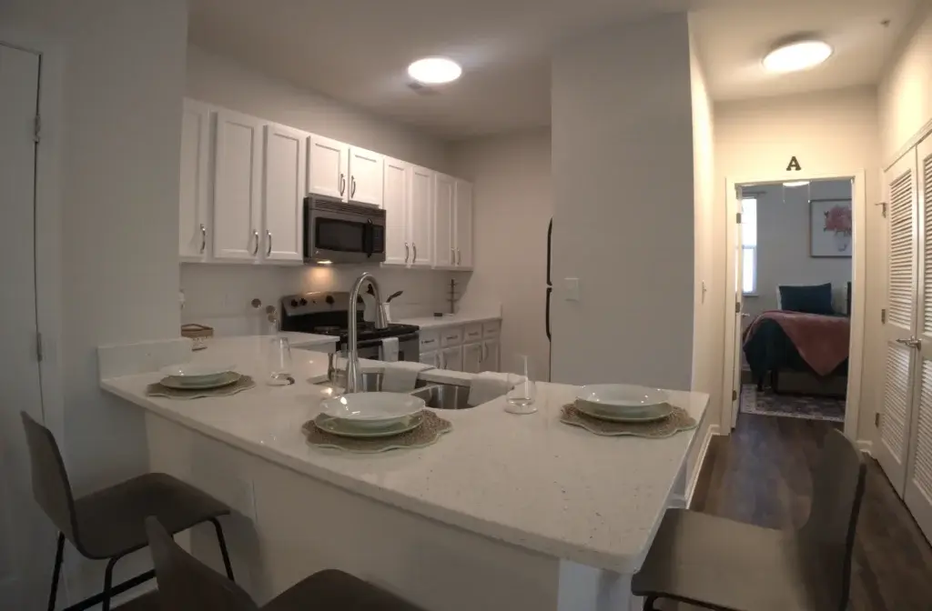 Gather Around the Oversized Kitchen Island Perfect for Roommates and Entertaining Image